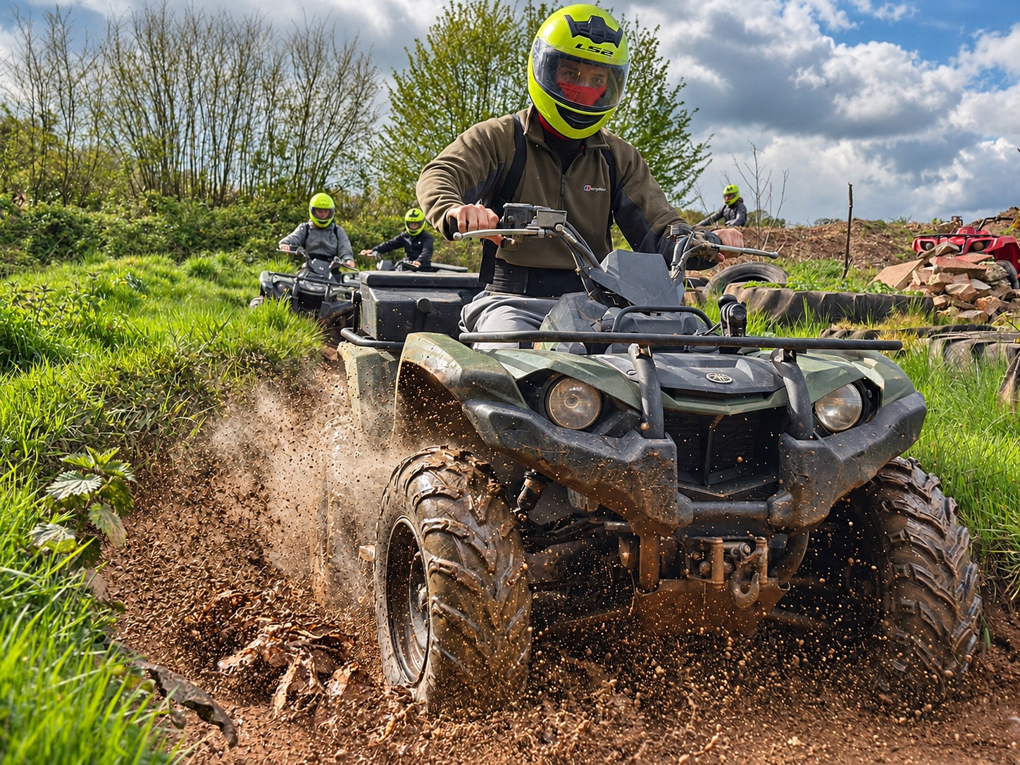 A rider kicking up mud on a quad safari